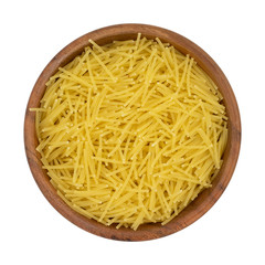 Uncooked vermicelli pasta in wooden bowl. Isolated on white background with clipping path