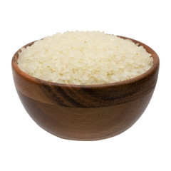 Round rice in wooden bowl isolated on white background.