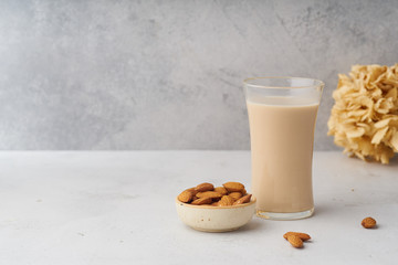 A glass of almond milk. Healthy protein drink suitale for vegans. Dairy alternative