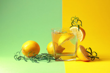 Gin tonic cocktail with lemon and rosemary.