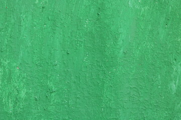 Obraz premium Beautiful vintage green background with old green paint with a rough surface, streaks and uneven texture of green paint on an old rough surface