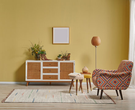 Yellow Living Room Wall And Wicker Cabinet, Orange Lamp And Frame Style With Chair.