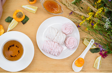 Delicious light dessert - marshmallow, fragrant tea, lemon, ginger, wild flowers