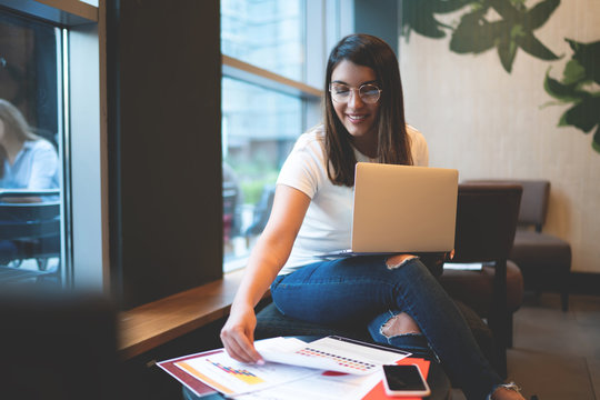Cheerful Young Woman Working On Diploma In College Room