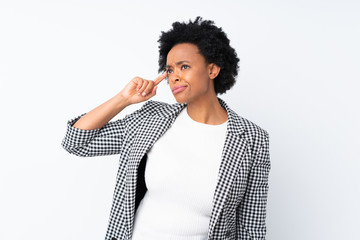 African american woman with blazer over isolated white background making the gesture of madness putting finger on the head