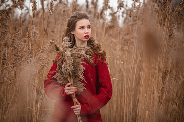 Polina with a bouquet of reeds