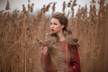 Polina with a bouquet of reeds