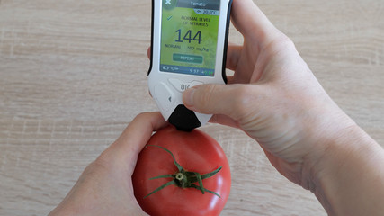 Nitrate tester is showing safe nitrate level in tomato.