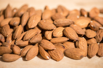 Group of raw shelled almonds from Sicily,, macro shot, horizontal view, selective focus.