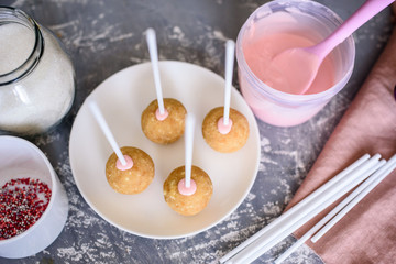 The process of creating dessert with the hands of a pastry chef. Cream, cake, sugar.