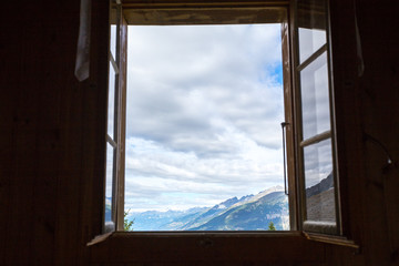 view of the window in switzerland, view of the mountains from the house