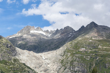 The mountains of Switzerland, the summits of the mountains with snow in summer