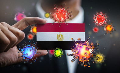Corona Virus Around Egypt Flag. Concept Pandemic Outbreak in Country