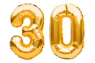 Number 30 thirty made of golden inflatable balloons isolated on white. Helium balloons, gold foil...