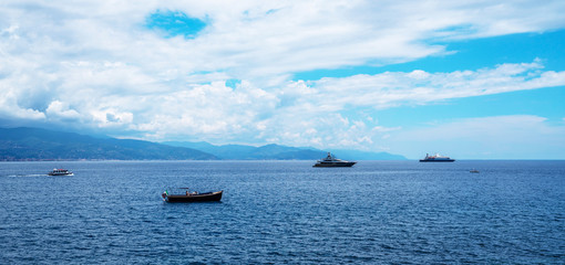 Freedom, sea, yacht, summer. Luxury yacht vacation holiday cruise. Recreation on the boat near the shore of a beautiful coast Ligurian. Colorful seascape of Adriatic sea. Traveling background.