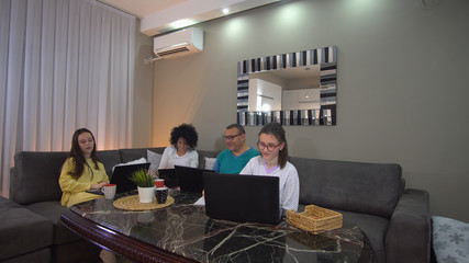 Family at home in pyjama, distant work and education as prevention from corona virus spread.  Quarantine and Social distancing concept