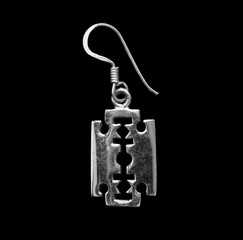 Silver earring. Jewelry. 
Razor blade. Pendant.