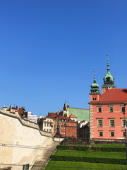 Fototapeta premium Warsaw, Poland - 21/ 06/ 2019:. Beautiful multi-colored houses in the old town in Warsaw. The central streets of the historic center of Warsaw. The main tourist attraction of Warsaw. 