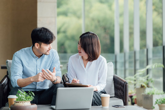 Young Asian business man and woman
