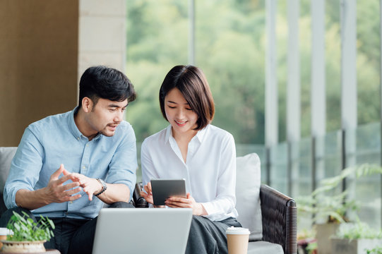 Young Asian business man and woman