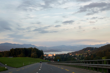 Asphalt road in Switzerland, road between the Alps mountains