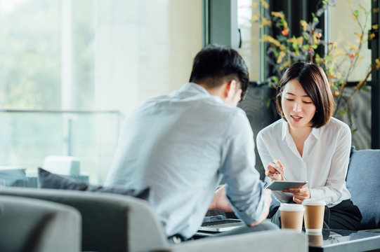 Young Asian business man and woman