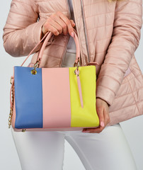 handbag should compliment you. wear elegant style. fashion model hold leather bag. woman with...