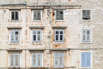 SPLIT, CROATIA - 2017 AUGUST 15. Old building  In The Old Town Of Split  with windows protected by closed wooden shutters.
