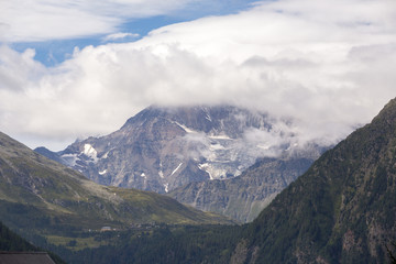 The mountains of Switzerland, the summits of the mountains with snow in summer