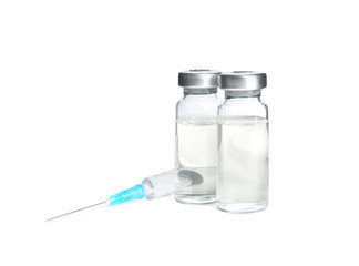 Vials and syringe on white background. Vaccination and immunization