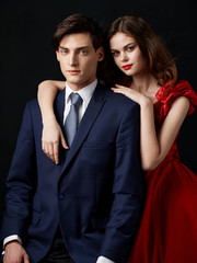 young man and woman in black