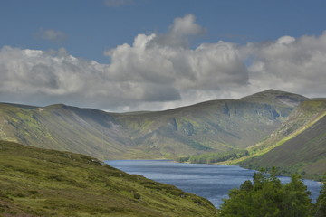 Fototapeta premium UK, Scotland, mountain landscape with lake and clouds, hdr