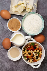 Easter cake baking ingredients on gray background close-up
