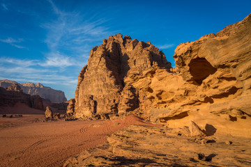 Bedouin camps from a distance in wadi rum with panoramic view and stones