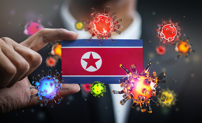 Corona Virus Around North Korea Flag. Concept Pandemic Outbreak in Country