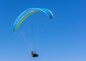 Lone Paraglider in mid-air.
