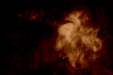 Orange smoke isolated on a black background. smoke image is like a ghost. Mystic
