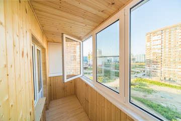 White metal-plastic open window of balcony in modern apartment