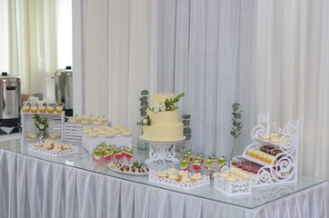 Wedding sweet table with cake and desserts