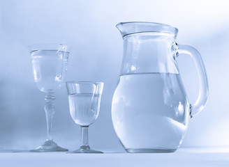 Jug and glass with drinking water
