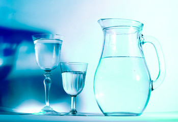 Jug and glass with drinking water
