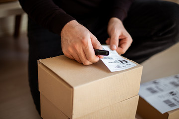 Delivery service, applying a shipping label	
