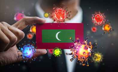 Corona Virus Around Maldives Flag. Concept Pandemic Outbreak in Country