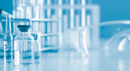 Serum liquid bottle to test tube, laboratory research and development concept. scientist sample chemistry or medicine test. Sampling of covid-19 infectious idea.