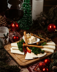 cheese plate with various cheese and crackers