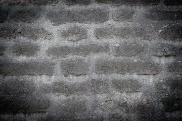 Background of old vintage dirty brick wall with peeling plaster, texture