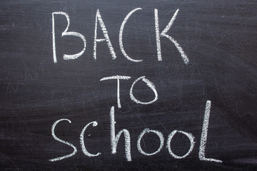 Fototapeta na wymiar Back to school blackboard. The text on the chalkboard.