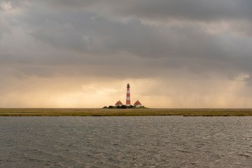 Fototapeta na wymiar Lighthouse Westerheversand in the natinal park Schleswig-Holstein Wadden Sea