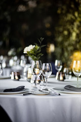 Beautiful table set for an event party or wedding reception . restaurant interior	