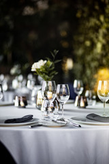 Beautiful table set for an event party or wedding reception . restaurant interior	